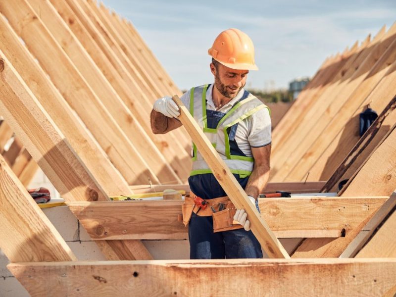 focused-builder-is-adjusting-a-wooden-bar-to-a-roof-carcass-1024x682-1.jpg